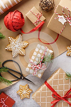 Christmas gift boxes, wrapping paper, cookies and red ribbon