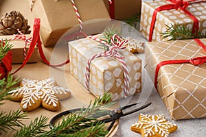 Christmas gift boxes, wrapping paper, cookies and red twine