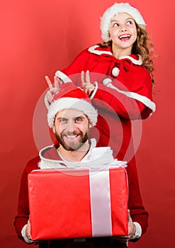 Christmas gift for child. Dad in santa costume and daughter cute kid. Happy childhood. Christmas family holiday. Father