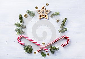Christmas gift composition. Christmas holiday sweets and fir tree branch on white background. Flat lay, top view
