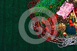 Christmas, New Year green stylish background and frame with pink gifts box and green gift bag with red bow, copy space