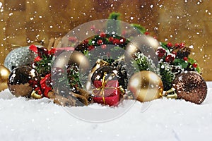 Christmas gift and decorations nestled in snow