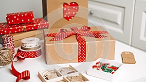 Christmas Gift ideas web banner. Red brown Xmas Gift box, kraft paper shopping bag and ribbons for wrapping. Sustainable