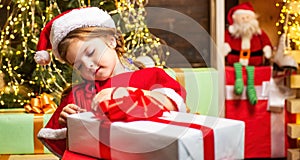 Christmas gift for kids. Happy child with Christmas gift box.