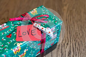 Christmas gift with Love. Valentine gift packages occasion for a gift to your loved one. Gift package with red ticket with LOVE