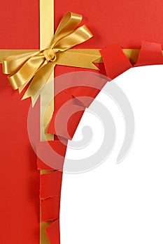 Christmas gift red background, gold ribbon bow, corner torn open