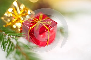 Christmas gift on snow macro