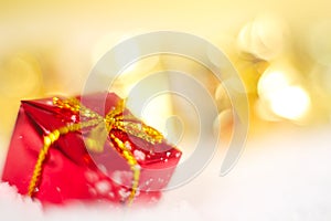 Christmas gift on snow macro