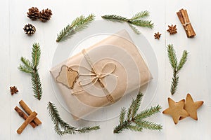 Christmas gift, thread, pine cone, pine needles and Ginger Cookies.