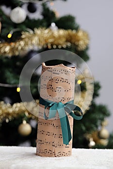 Christmas Gift Wrapped in a Music Themed Paper with Green Ribbon