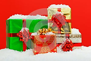 Christmas gift wrapped presents red background.
