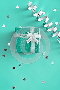 Christmas gifts on blue background with glitters.