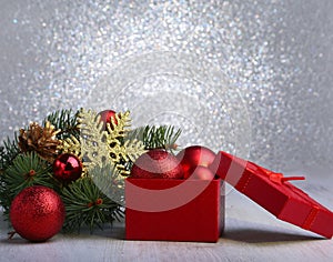 Christmas gifts. Christmas decoration with presents and red ball with fir branches