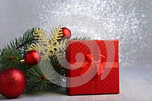 Christmas gifts. Christmas decoration with presents and red ball with fir branches