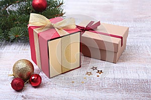 Christmas gifts. Christmas decoration with presents and red ball with fir branches