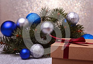 Christmas gifts. Christmas decoration with presents and red ball with fir branches
