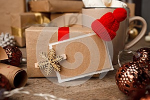 Christmas gifts with christmas decoration on vintage wooden background closeup, design template, copy space, front view.