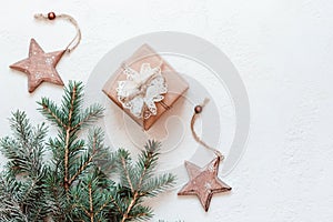 Christmas gifts decorated with natural reusable materials and wooden star baubles. Zero Waste Christmas