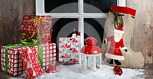 Christmas gifts decoration near the rustic window