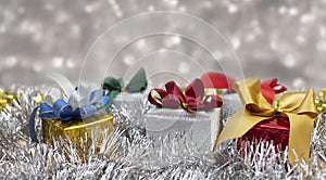 Christmas gifts decorations with silver glister blurred background