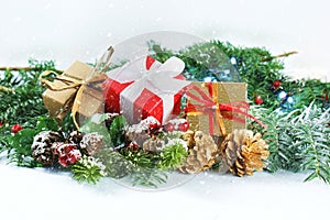 Christmas gifts and decorations with snow overlay