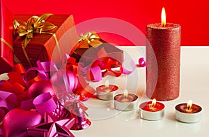 Christmas gifts and four candles