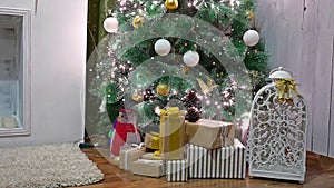Christmas gifts interior tree and New Year toys room blinking lights and fireplace