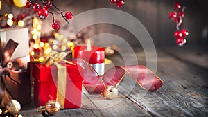 Christmas gifts over vintage wooden background