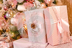 Christmas gifts in soft pink boxes