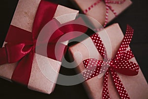 Christmas gifts and traditional holiday presents, classic xmas gift boxes on wooden background, present wrapped in craft