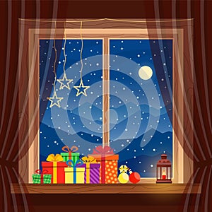 Christmas gifts on window with garlands, candle, lantern in cozy home on background of night blue mountains, snow