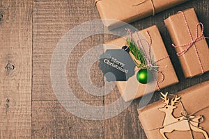 Christmas gifts on wooden background. Retro filter effect. View from above