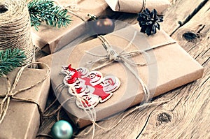 Christmas gifts on wooden table closeup. Rural or wooden style photo