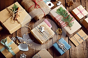 Christmas gifts on a wooden table. Ecological packaging.
