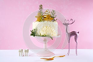 Christmas gingerbread cake against a pink background.