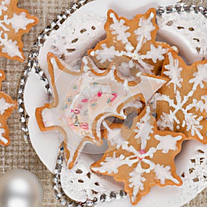 Christmas gingerbread cookies, with festive mugs for hot chocolate, Christmas decor and baubles, white background