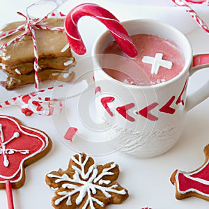 Christmas gingerbread cookies, with festive mugs for hot chocolate, Christmas decor and baubles, white background