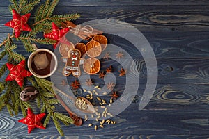 Christmas gingerbread cookies with icing, cup of tea, fir-tree b photo