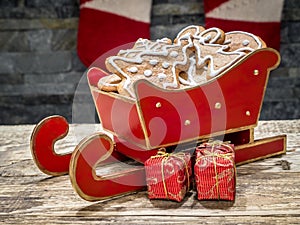 Christmas gingerbread cookies in red mini sleigh