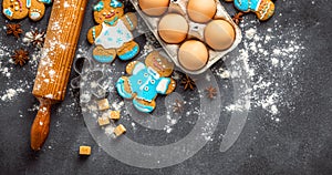 Christmas gingerbread on dark background top view. Xmas holiday celebration and cooking