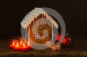 Christmas gingerbread house and candles