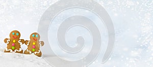 Christmas gingerbread men on the background of snow.banner photo