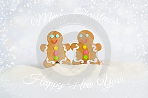 Christmas gingerbread men on the background of snow photo