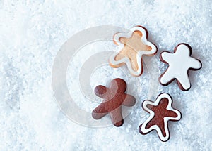 Christmas gingerbread men on snow