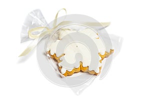 Christmas gingerbread in the shape of a star on a white background. Packed as a gift or decor. Isolated
