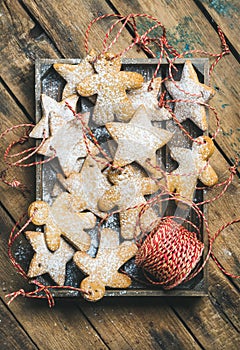 Christmas gingerbread star and angel shaped cookies with sugar powder