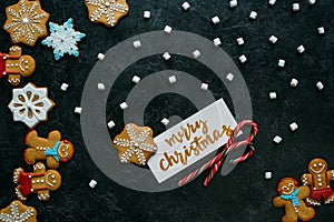 Christmas gingerbreads, marshmallows and greeting card