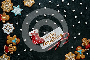 Christmas gingerbreads, marshmallows and greeting card