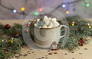 Christmas Gingerman in a mug with hot cocoa and marshmallow.