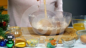 Christmas gingersnap with female hands. Woman kneading dough